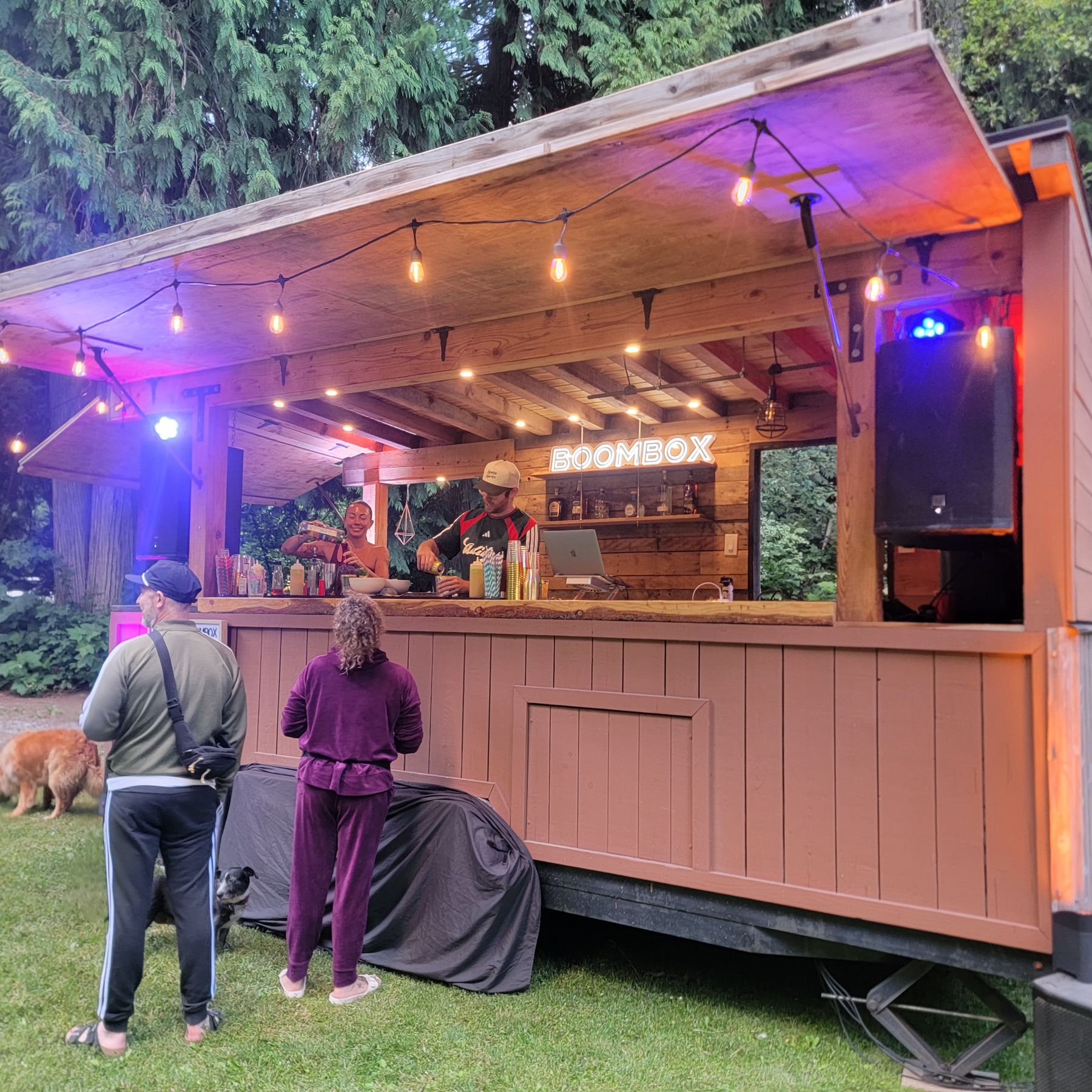 The Boombox lit up for an evening event with its BOOMBOX neon sign