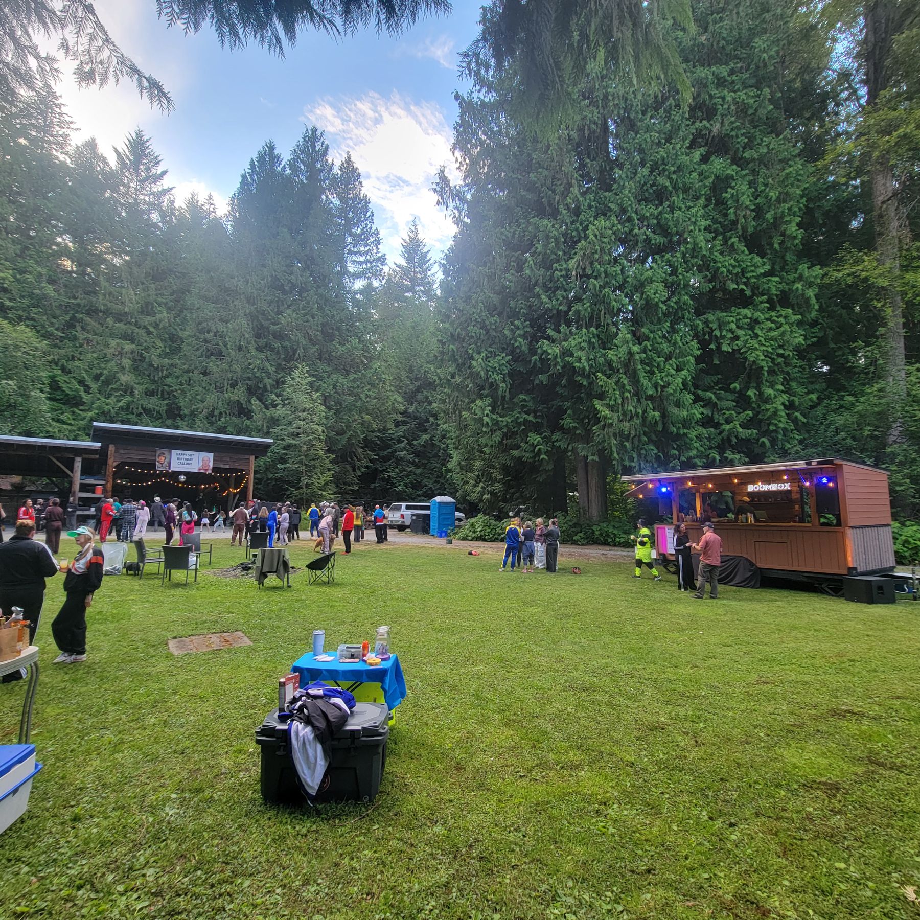 A crowd at an outdoor event with the Boombox on the field