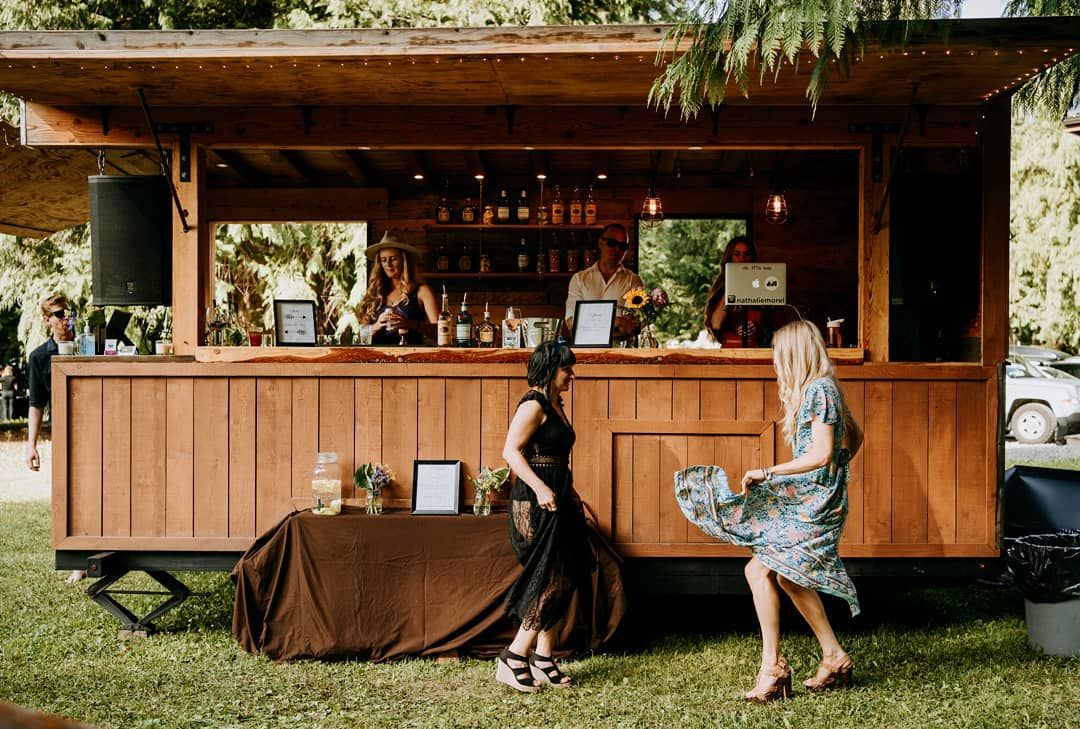 Wedding guests dancing in front of the bar